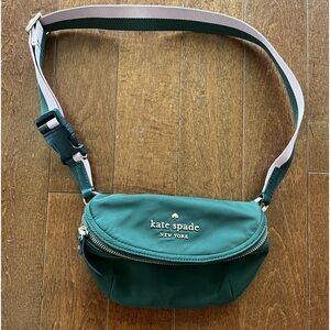 Dark green Kate Spade belt bag with pink and gold detail